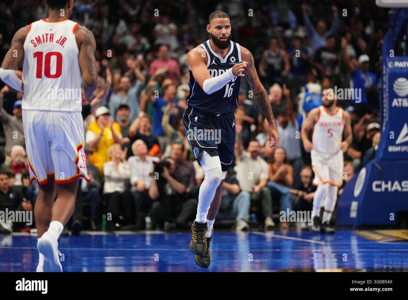 Pointer Nba Dallas Mavericks' Caleb Martin (16) celebrates after sinking a three ...