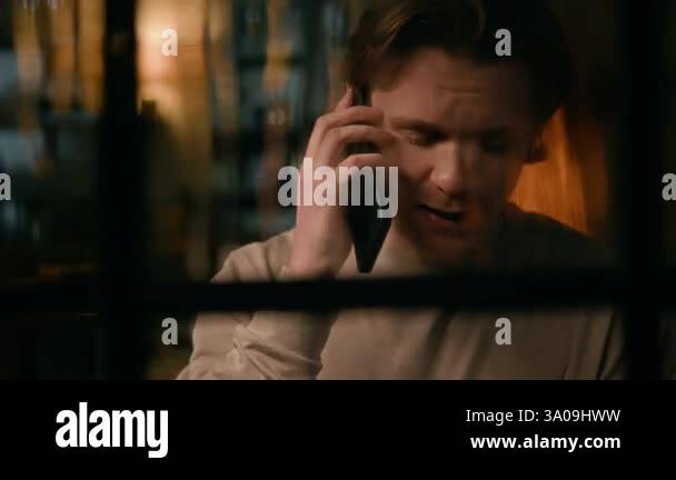 Medium closeup of agitated young Caucasian man pacing around living ...