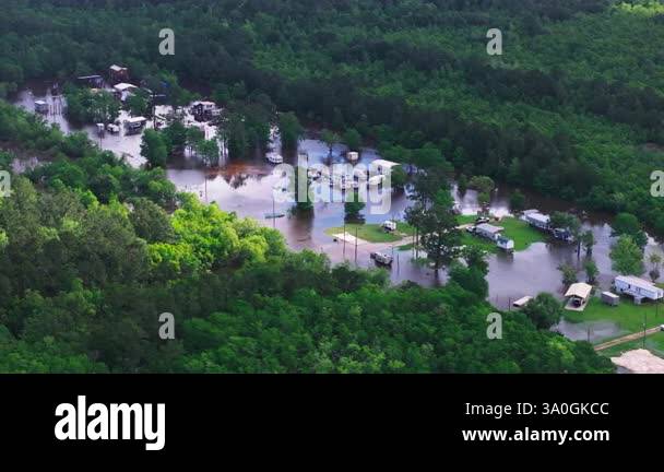 Caming Disaster Aerial view of a flooded Louisiana camping site with buildings and ...