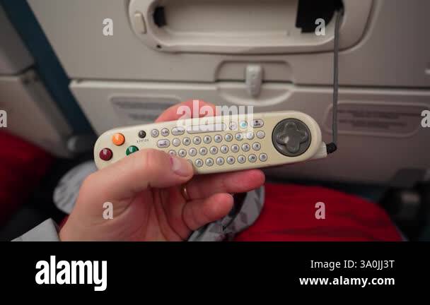 Istanbul, Turkey - February 23, 2025 - A passenger holds an in-flight ...