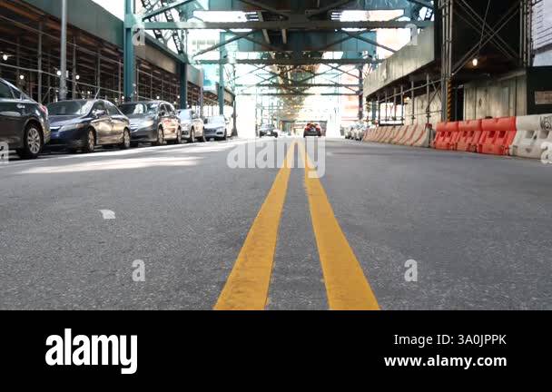 Elevated subway above New York city street. Metropolitan bridge over ...