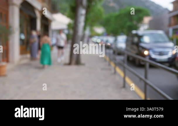 Blurred outdoor scene in mallorca with defocused background, people ...