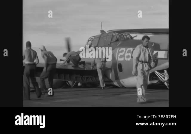 PACIFIC OCEAN - 1945 - US Navy crewmen on an aircraft carrier use a ...