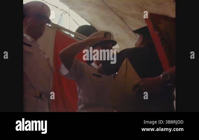 VIETNAM - 1970 - A USN Captain addresses the audience from the rostrum ...