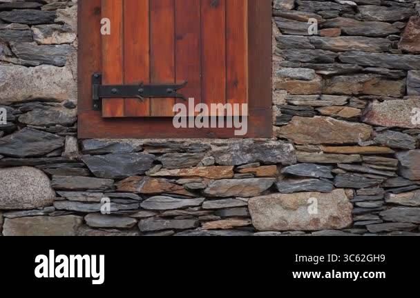 A charming and picturesque rustic stone wall showcasing a classic ...