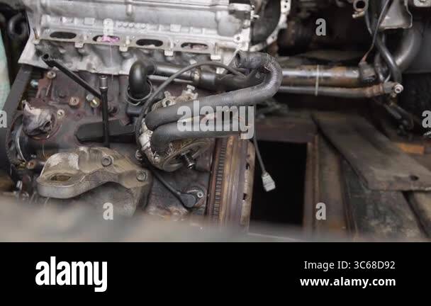 Used car's engine is ready to be installed, making sure that all ...