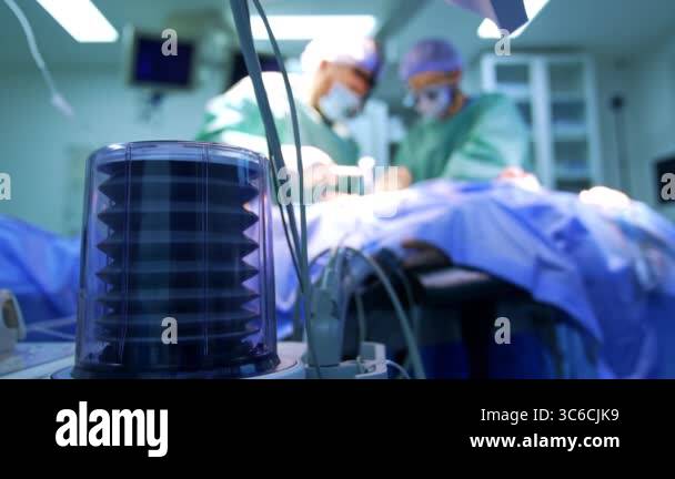 Lung ventilator pump working in surgery room. Close up. Surgeon uses a ...