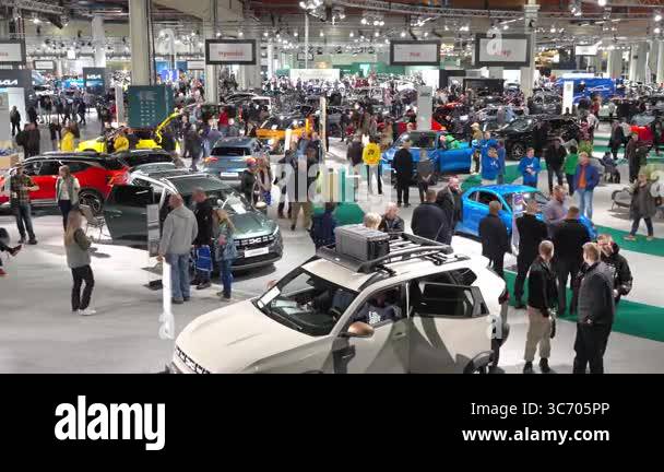 Helsinki, Finland - March 15, 2025: A crowded auto show with people ...
