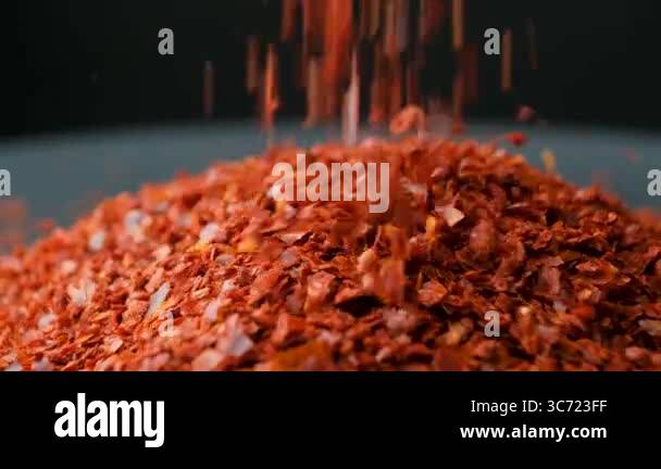 Crushed Dried Chili Sprinkle On Pile, Black Background, Macro, Slow ...