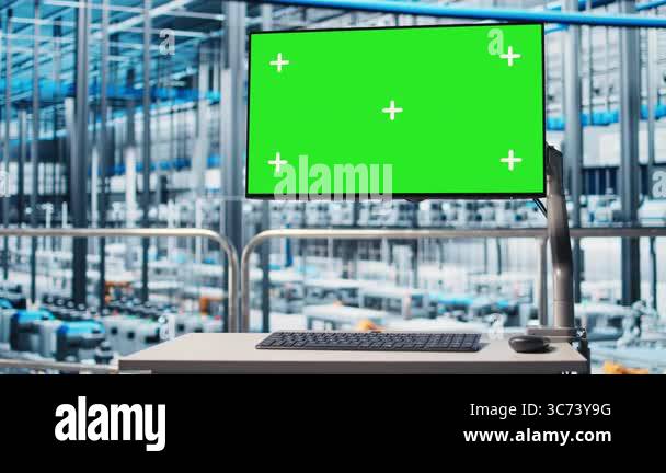 Chroma key monitor displaying industrial automation program overlooking ...