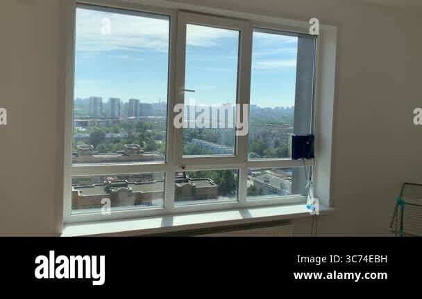 Picture of Automatic window cleaning robot working on a high rise building window ...