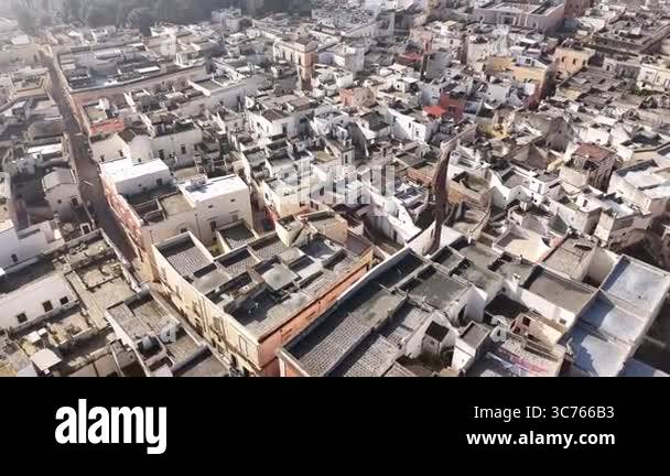 Drone shot capturing a top-down view of an old densely built ...