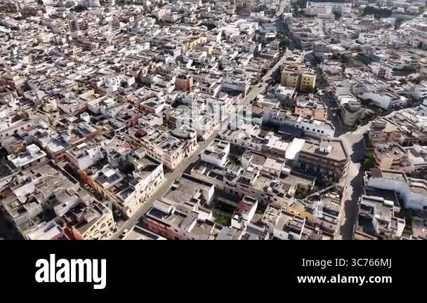 Drone shot capturing a top-down view of an old densely built ...