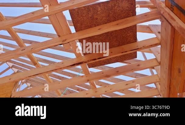 Wooden beams are arranged in triangular rectangular patterns ...