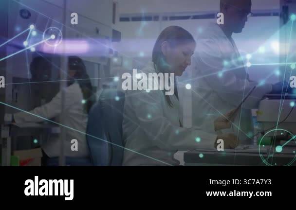 In lab, scientists analyzing digital network connections with animation ...