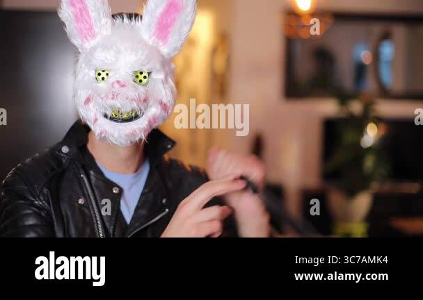 Spooky man wearing a creepy rabbit mask Stock Video Footage - Alamy