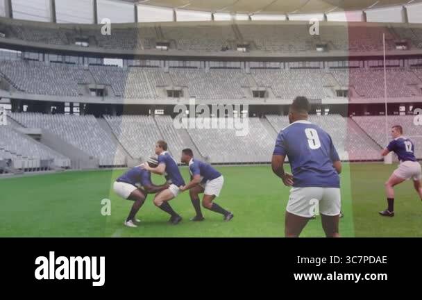 Practicing lineout lift, rugby players in blue jerseys on green field ...