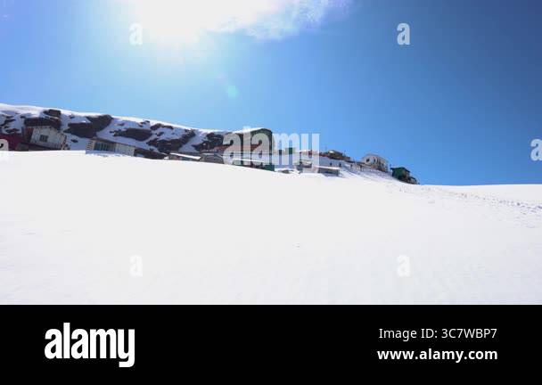Gallery Detail: Remote Shelters In Snow Clad Mountains With Vibrant Blue Sky