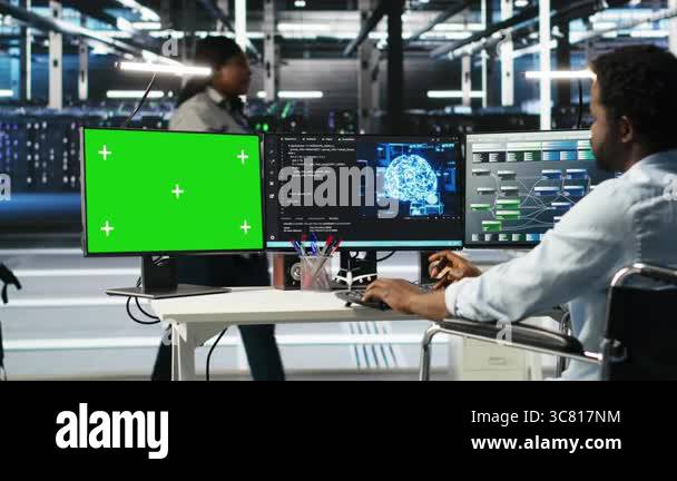 Data center admin in wheelchair using AI node tree software on green ...