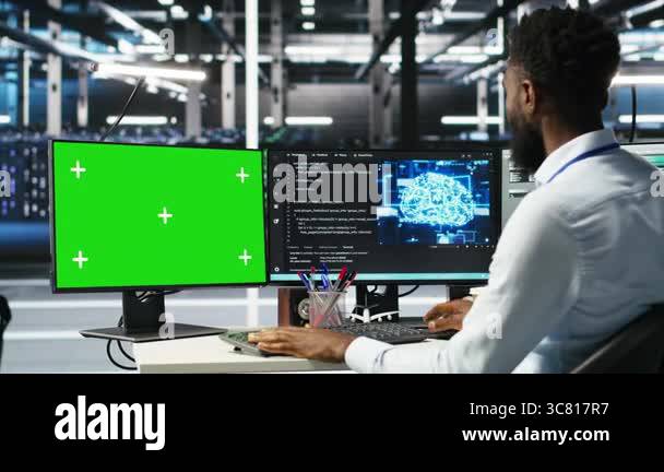 Data center admin using green screen PC to do node tree programming ...