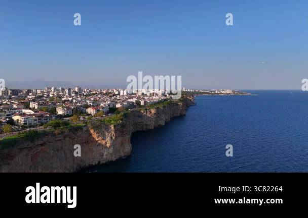 Drone rotation ends with breathtaking view of coastal cityscape ...