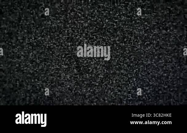 Macro view of television screen displaying intense static noise, a ...