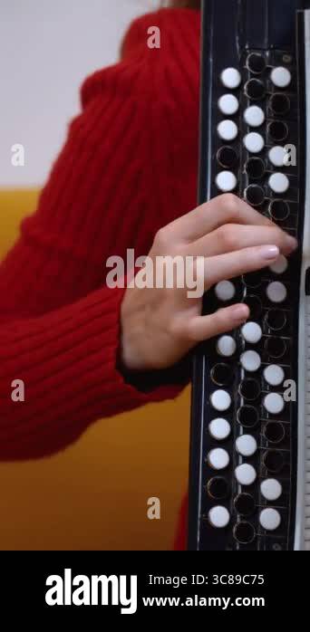 a close-up showing hands of musician skillfully playing traditional ...