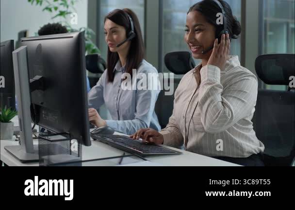 Use Computer Call Center Three business people multiethnic Indian Caucasian women African man ...