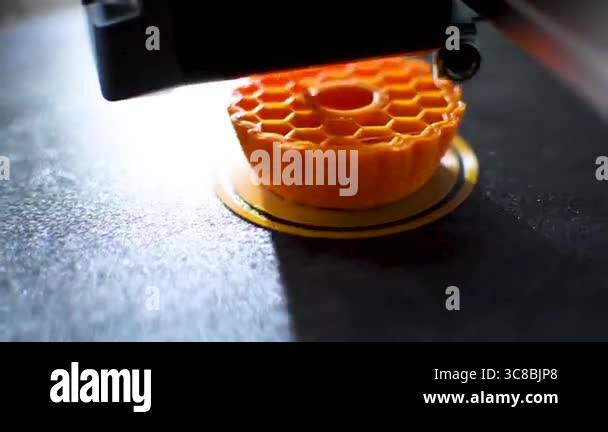 3d printer printing an object on the tray with pla filament, corn ...