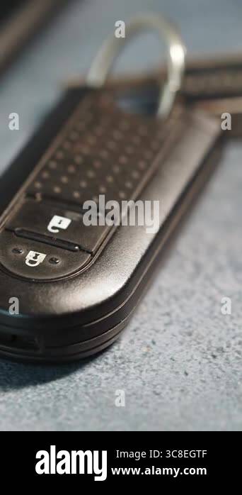 Close view of a car key fob showing buttons for locking and unlocking ...