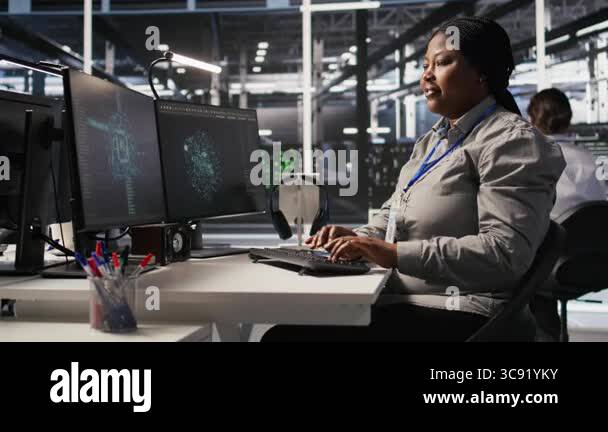 Woman in data center doing software updates, verifying machine learning ...