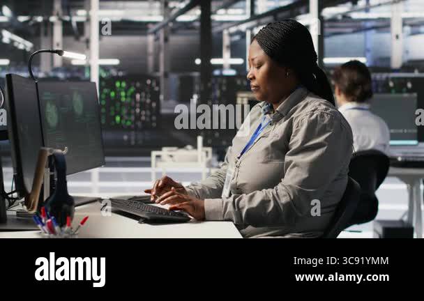 Scared data center technicians reacting to virus warning on PC display ...