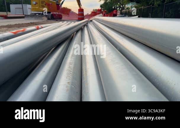 The video features a construction site displaying stacked stainless ...