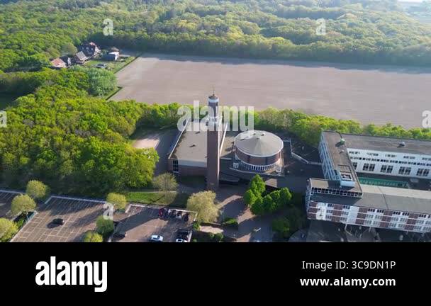 Aerial view of a rural area with a large building complex surrounded by ...