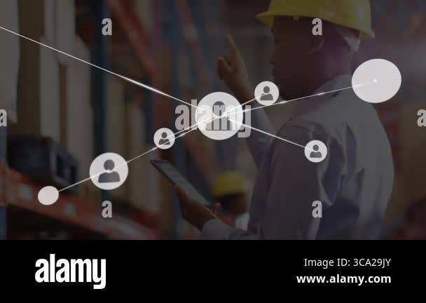 Warehouse worker tapping tablet, generating network icons linking ...