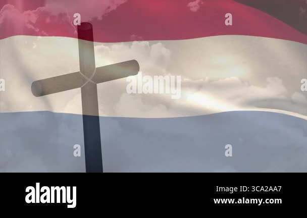 Soft light causing cross silhouette rising and breeze rippling tricolor ...