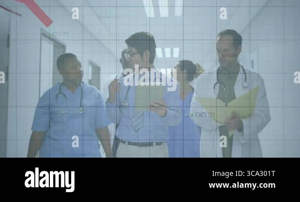 Medical team walking hospital corridor, tapping tablet and tracking ...
