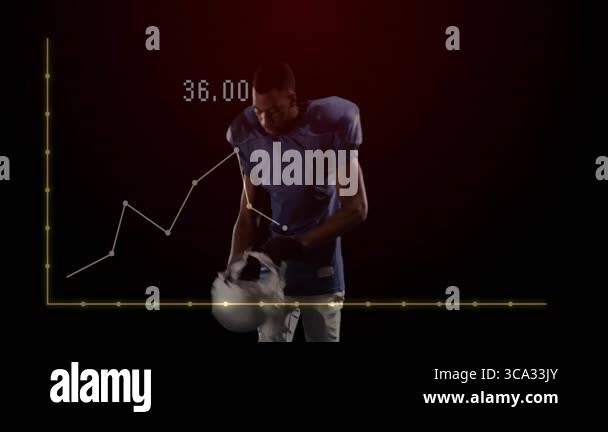 Football player adjusting facemask against dark studio backdrop ...