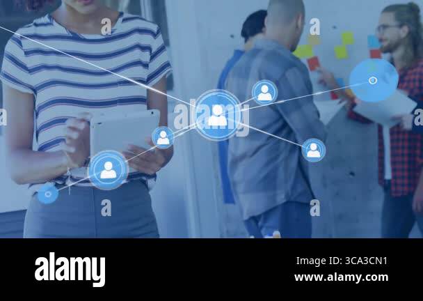 Woman tapping tablet visualizing tech network with expanding icons ...