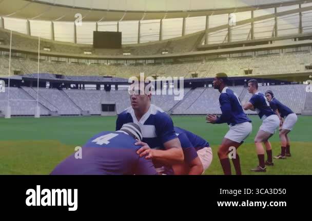 Male rugby players crouching on signal lifting jumper for lineout with ...
