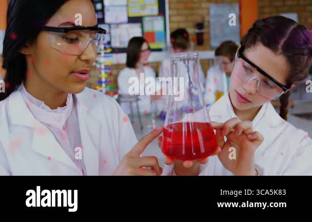 Students inspecting red liquid flask in chemistry lab, with red dashed ...