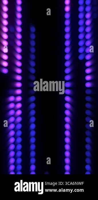 Bright lights flash in shades of purple and blue, forming captivating ...