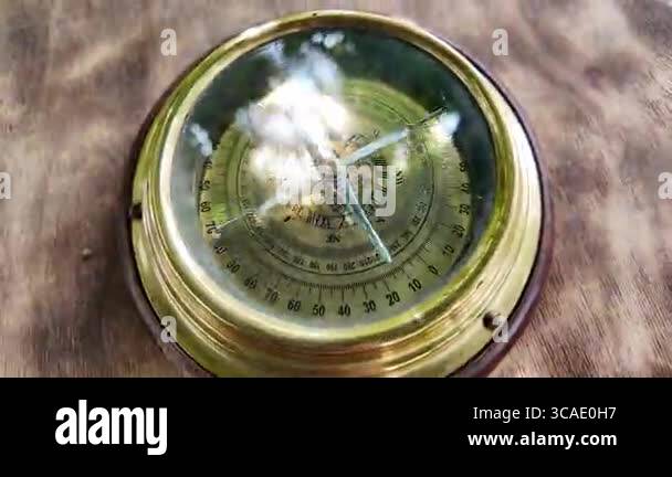 old compass in hands. Man using compass to find location. Close-up ...