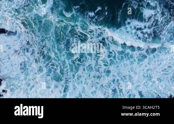 Experience breathtaking aerial footage of powerful ocean waves crashing ...