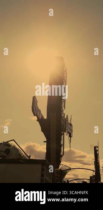 Spinning pendulum ride. The fair park full of running attractions ...