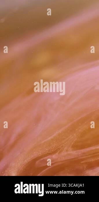 Vertical video. Splash vortex. Glitter blur. Defocused bright orange ...