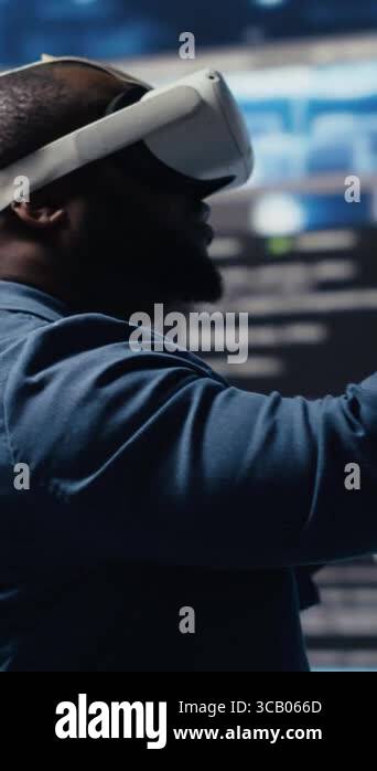 Vertical Video Digital tech expert coding and using VR headset at ...