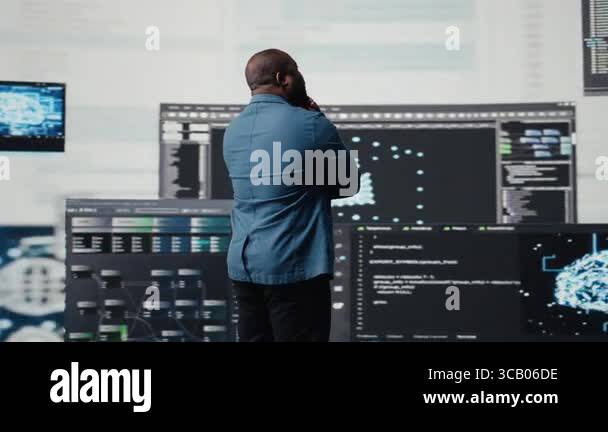 Black programmer expert engaging in software development at a high tech ...