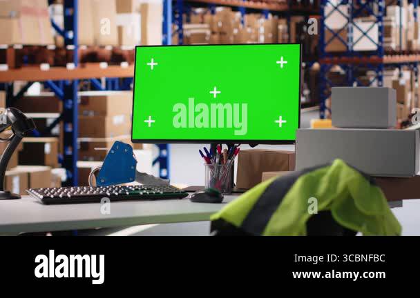 Empty warehouse space shows isolated chroma key display on pc, managing ...