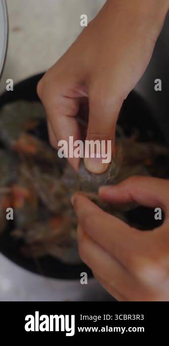 Watch as clean, fresh shrimp are meticulously cleaned and beautifully ...